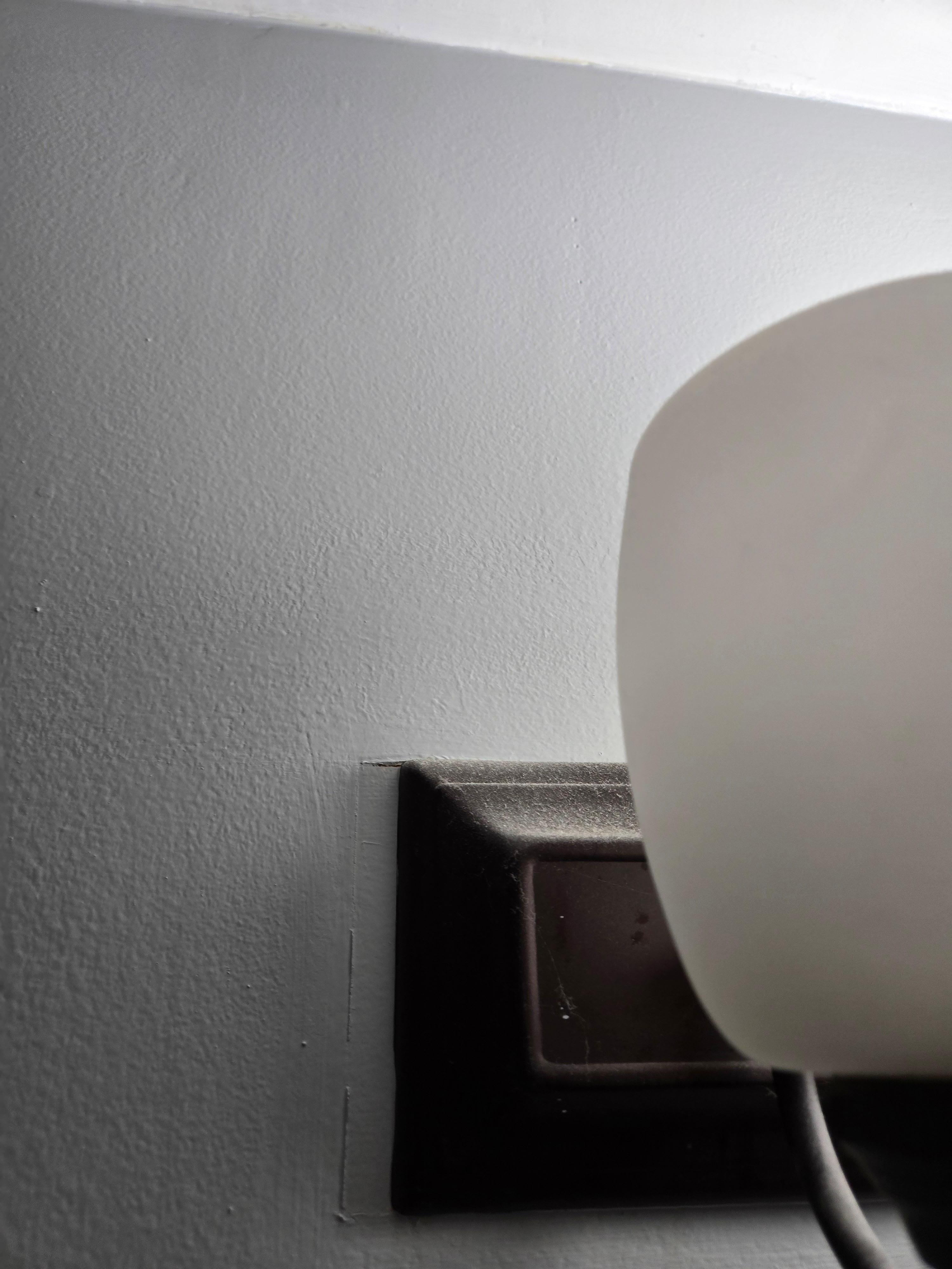 Dust on the light fixture in the bathroom