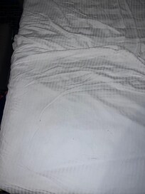 Dirty sheets from the sofa bed