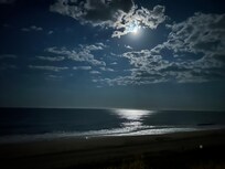 Moon over ocean from balcony