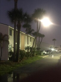 View of the condo with a full moon