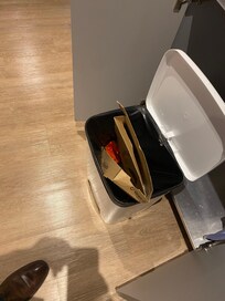 Pizza box with leftover smelling pizza inside