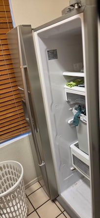 Laundry room has a broken fridge/freezer. Full of odds and ends.
Place needs new photos and descriptions for an accurate listing.