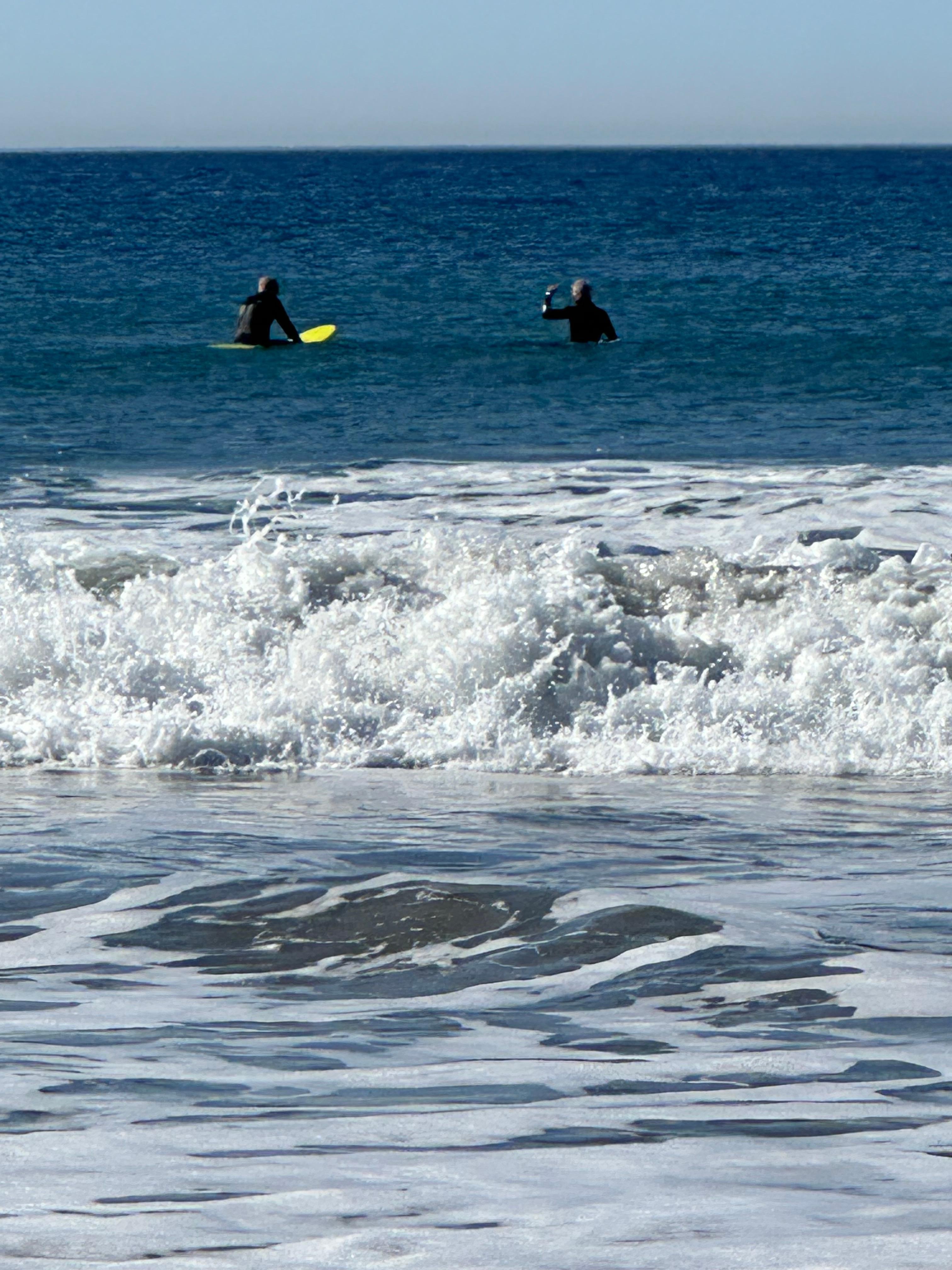 Surfers waiting for the next big wave