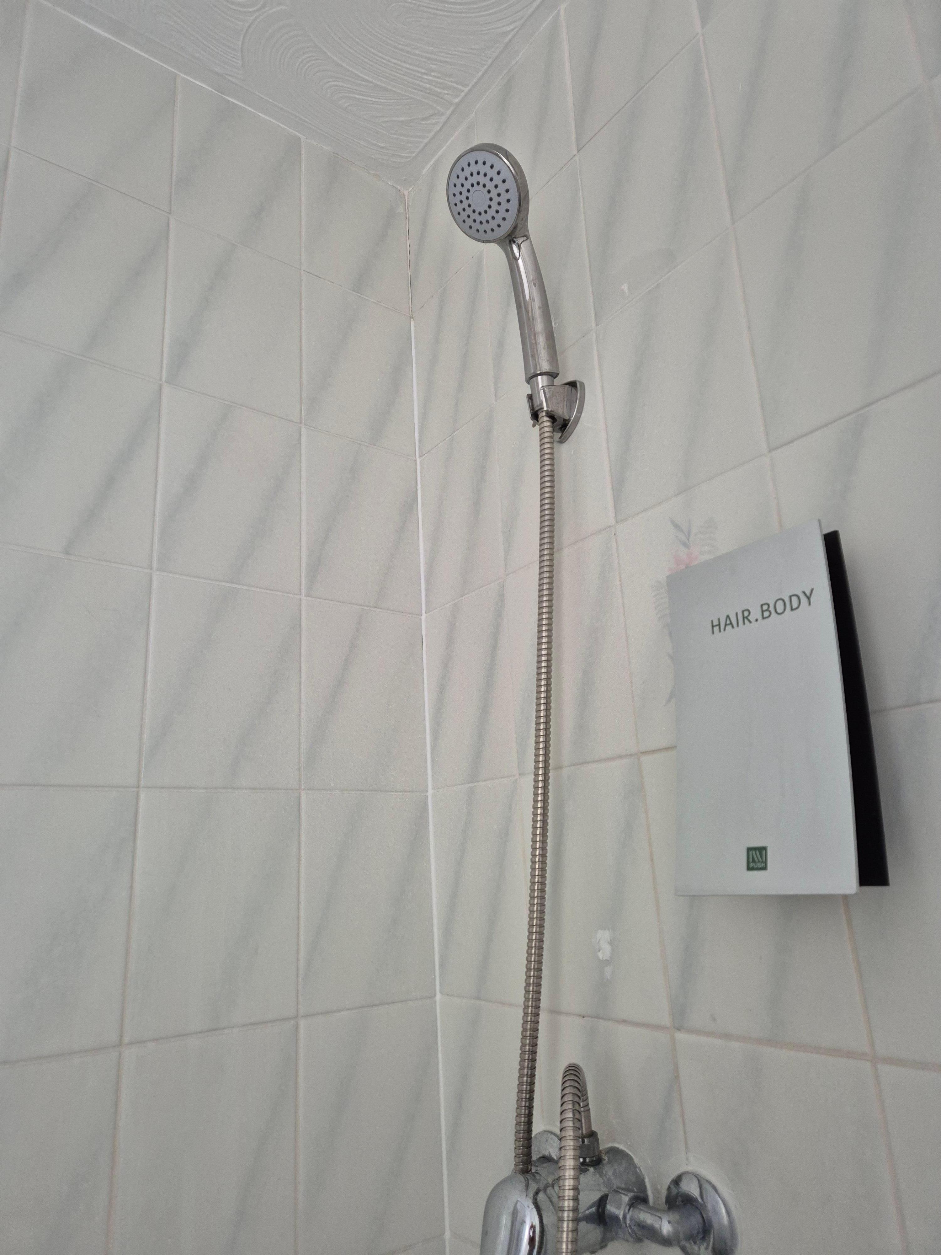 Shower attached to the wall