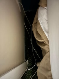 Ethernet wires were everywhere on the ground around bed and garbage was stuck there.