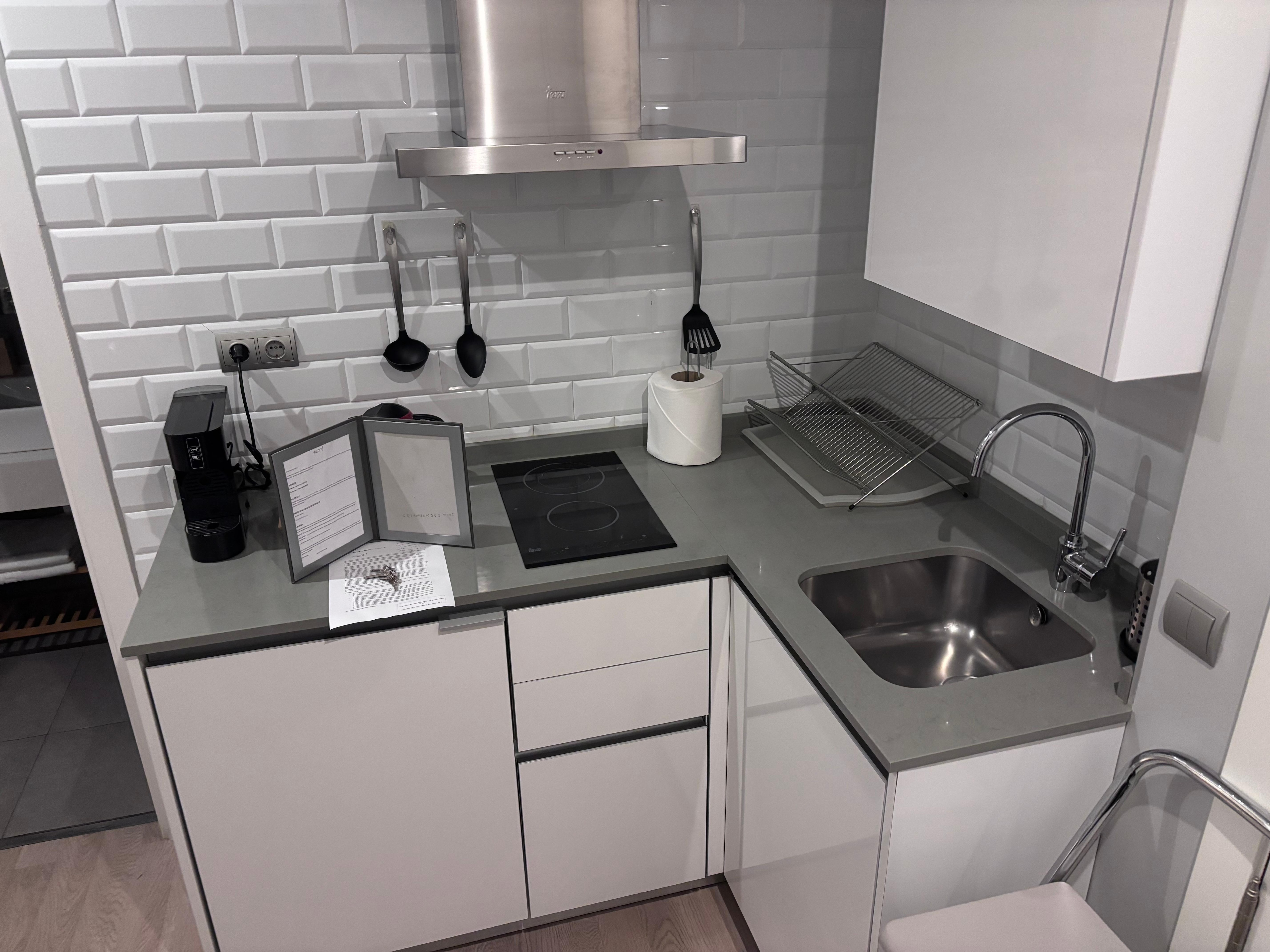 Full kitchen with washer/dryer, fridge, microwave, stove top, coffee and tea