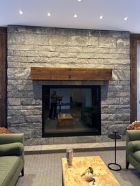 A large fireplace in the cozy lobby