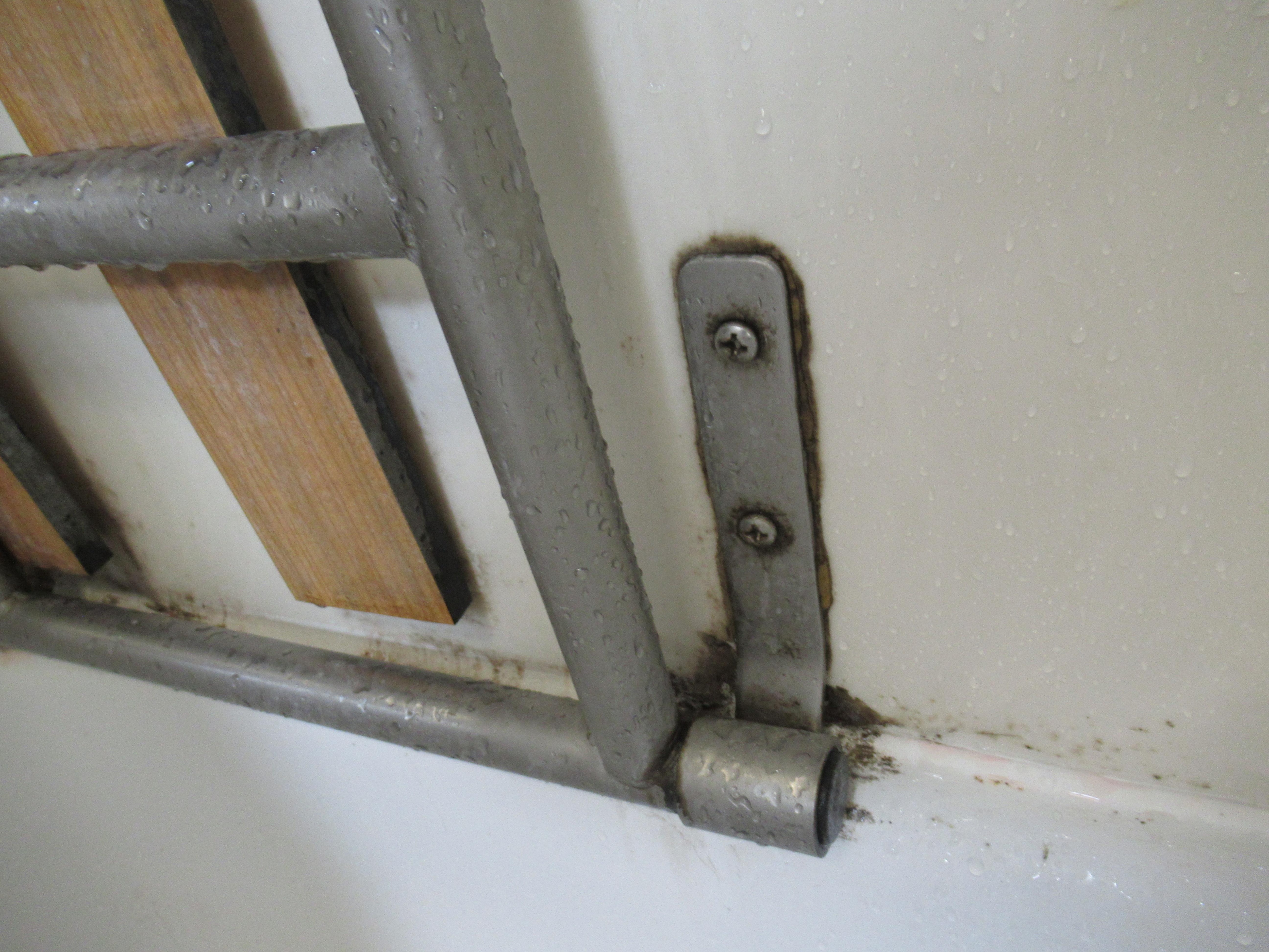 Moldy hinge in bathtub.  Supports chair seat in tub.
Needs a detail cleaning