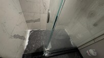 Puddle in bath shower