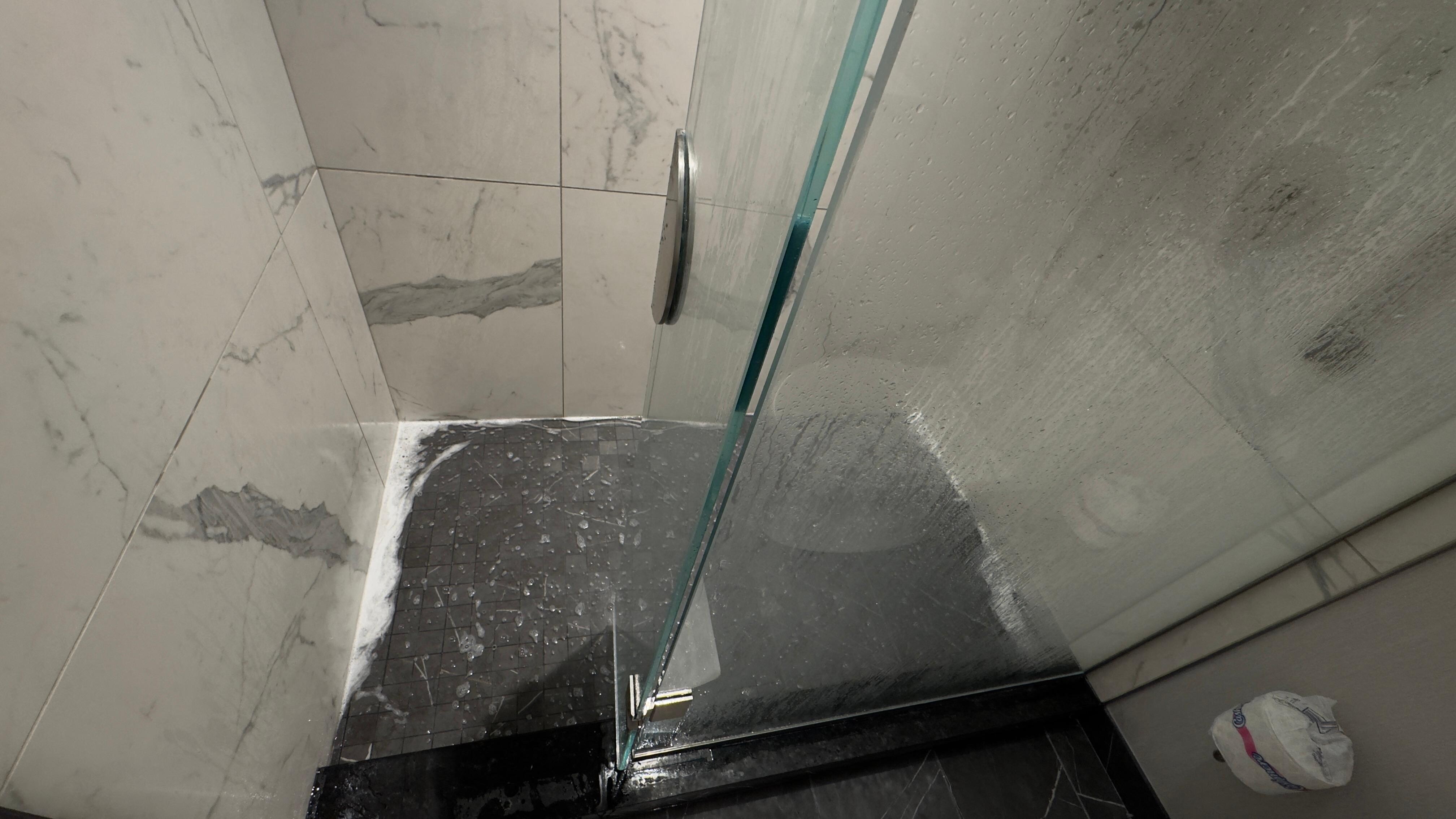 Puddle in bath shower