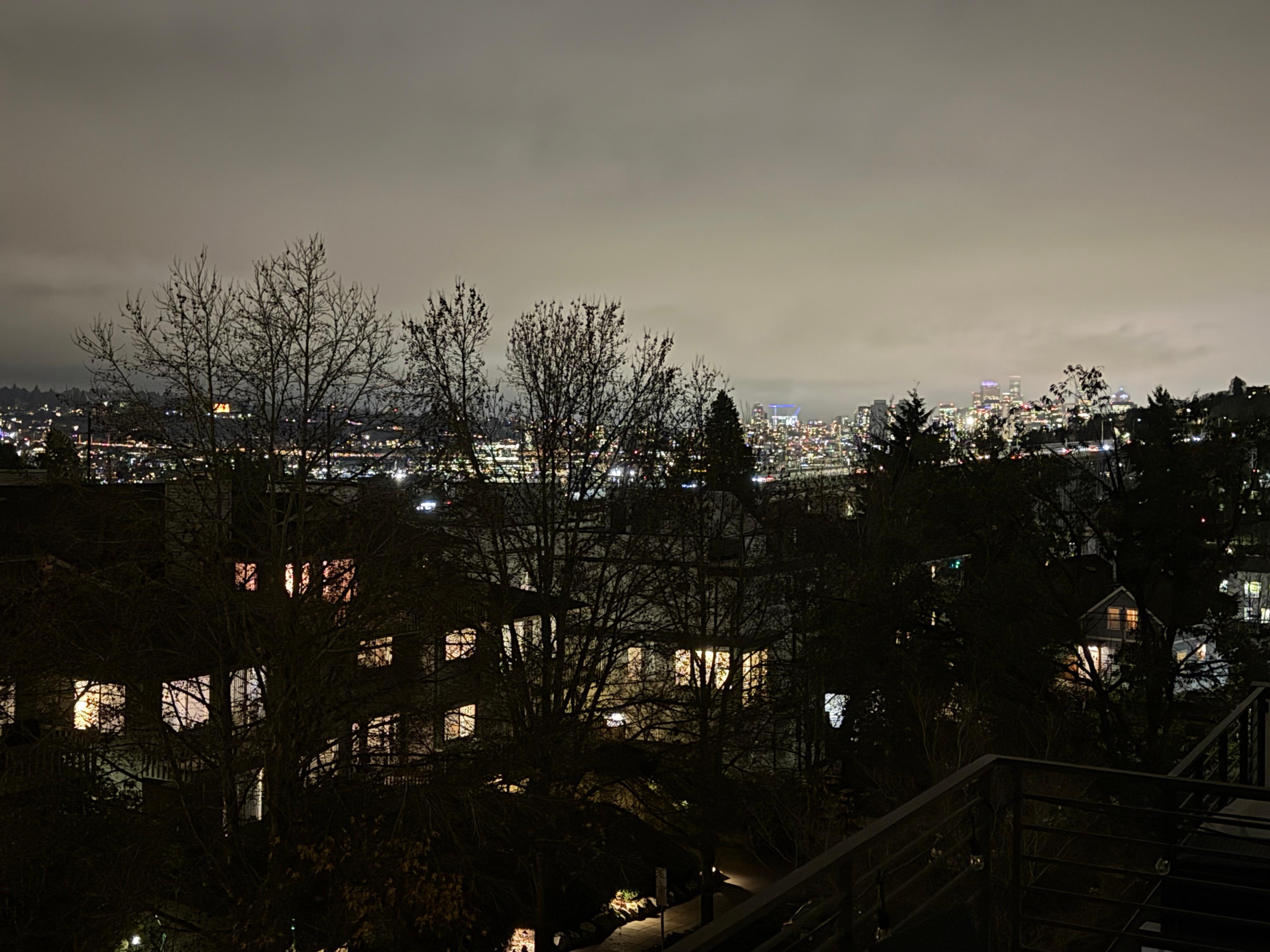 View to NE at night of Hwy99 Bridge and Seattle lights on the other side of Lake Union.