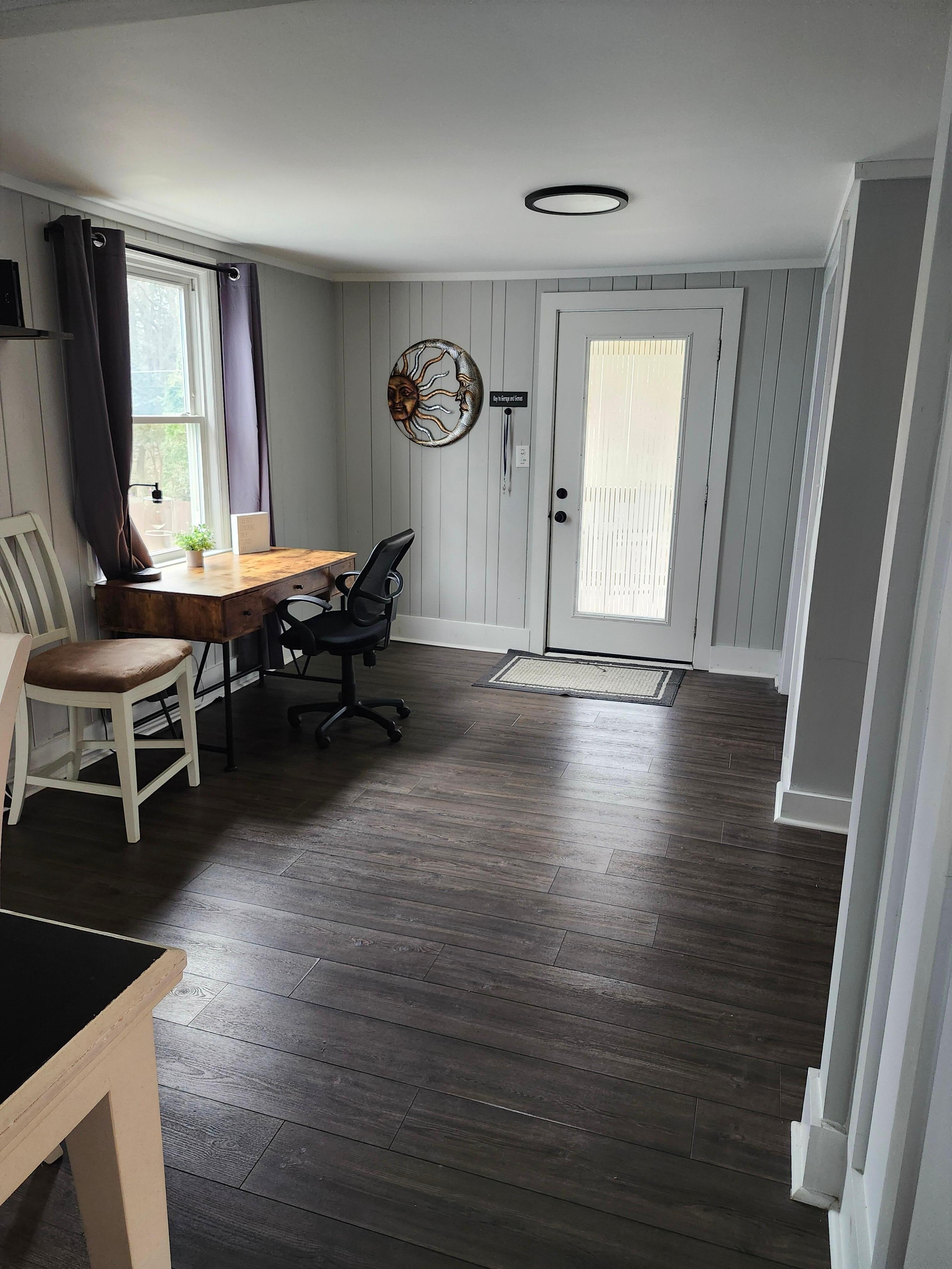 Office space near laundry nook, also works well as play room for kids