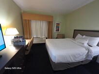 Desk and bed closest to window
