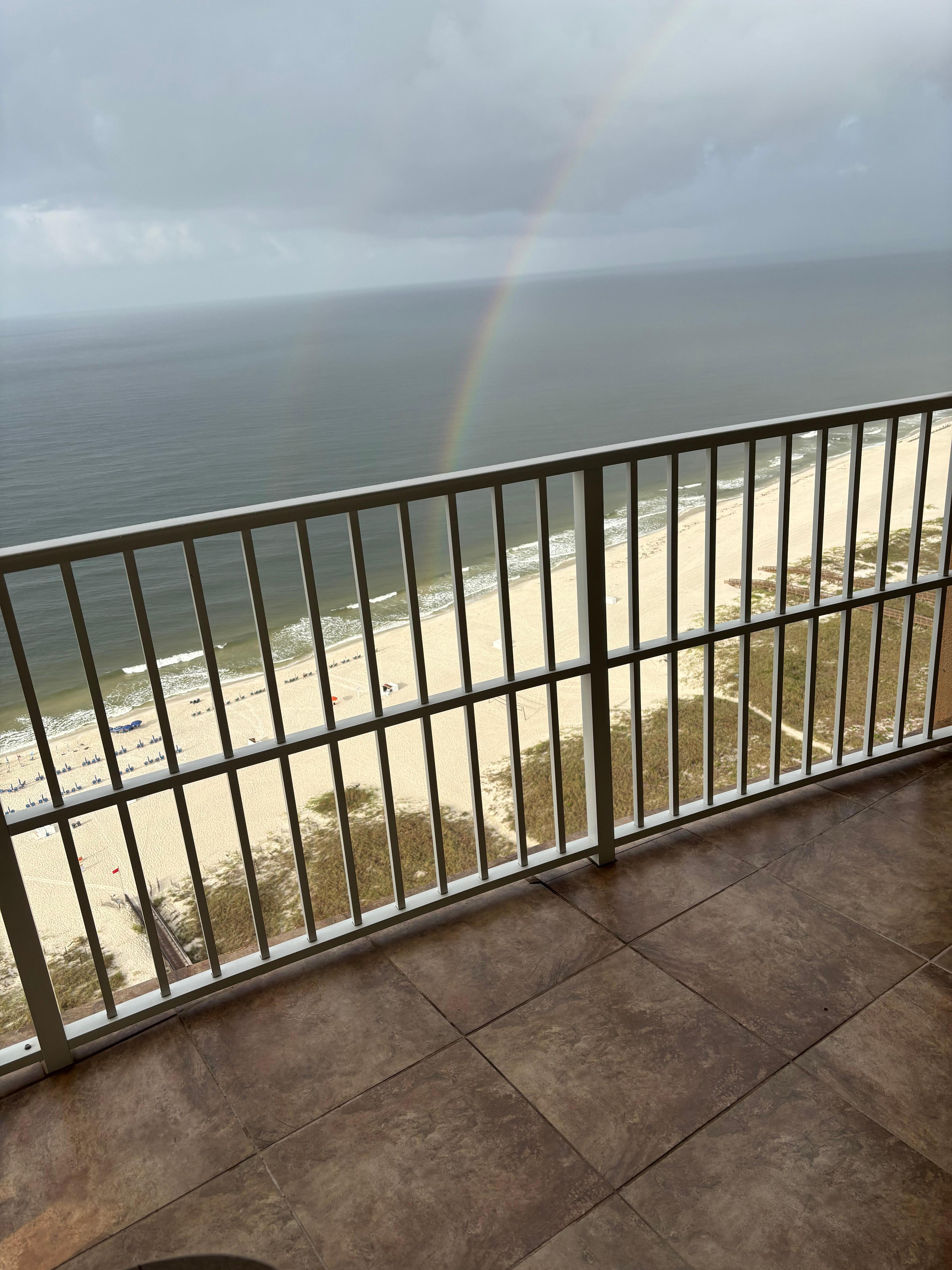 Rainbow touching the beach