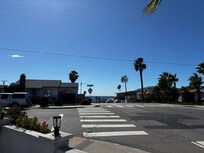 View from the front, busy corner. See the beach just down the hill.