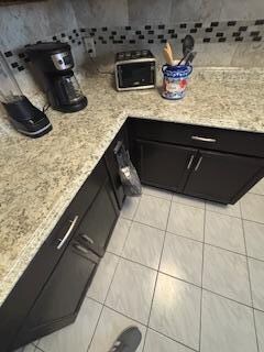 Garbage bag left hanging from cabinet