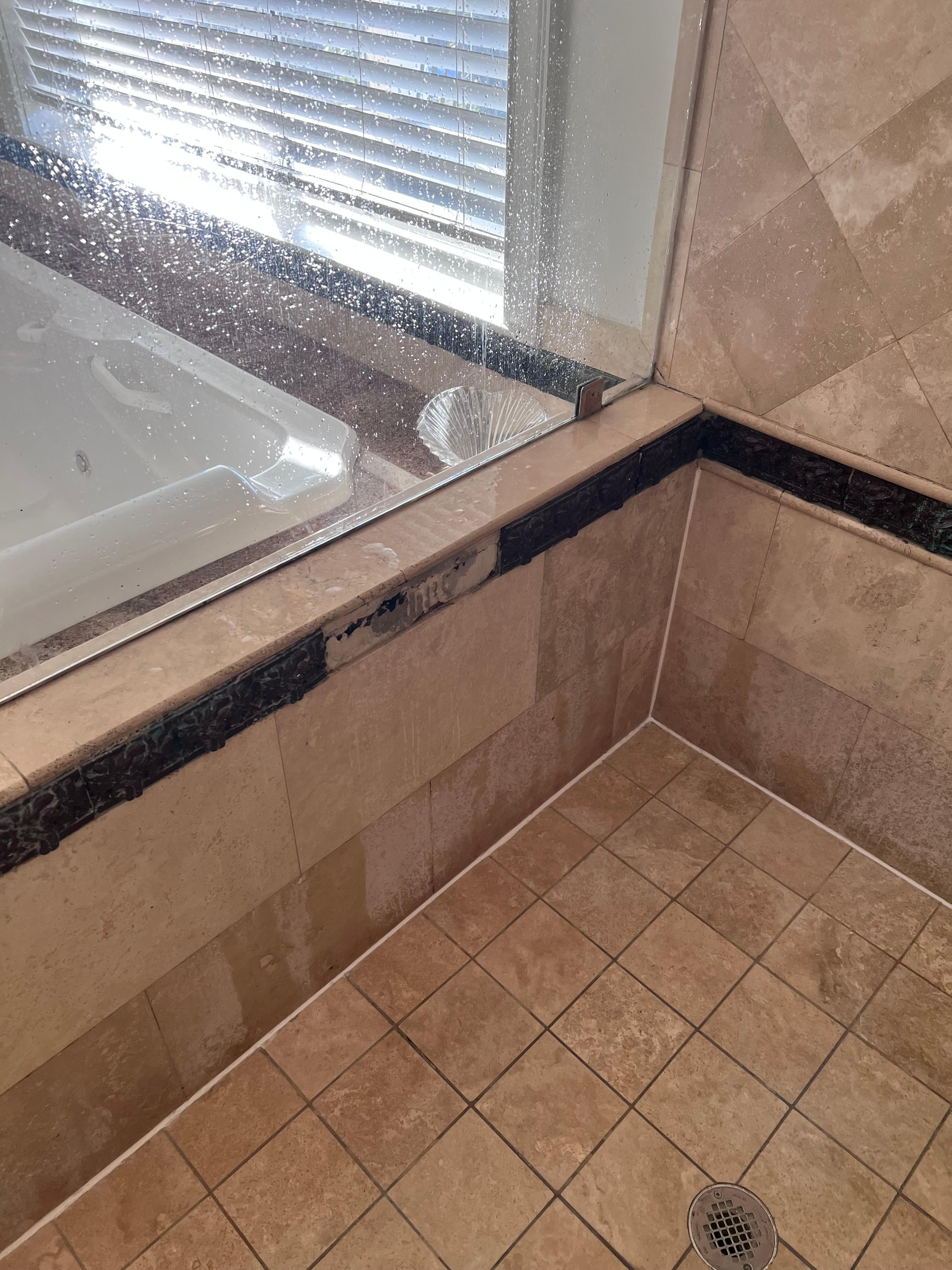 Upstairs master bath shower missing tiles and mold growing. Smelly too. 