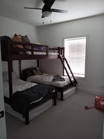 1 of the rooms with a bunk bed