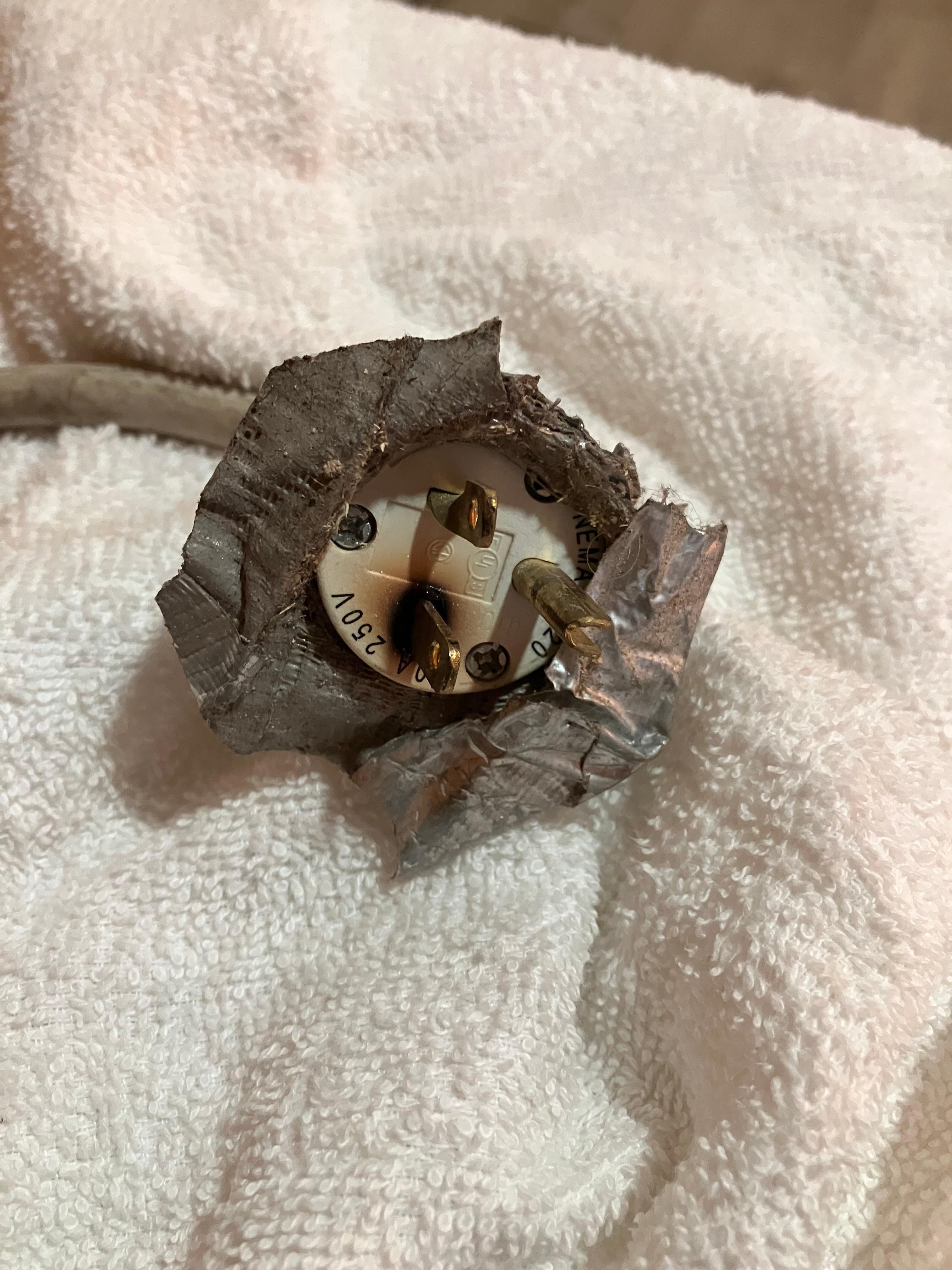 A/C, Nema 6-20 plug - melted. Very dangerous.