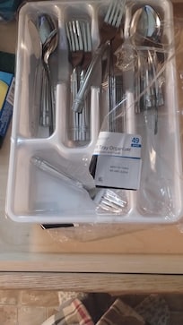 Silverware opened but plastic left on so never washed.