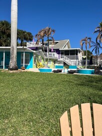 Looking up at the back of the house from the river. Screened porch on second floor is the Heron Room.