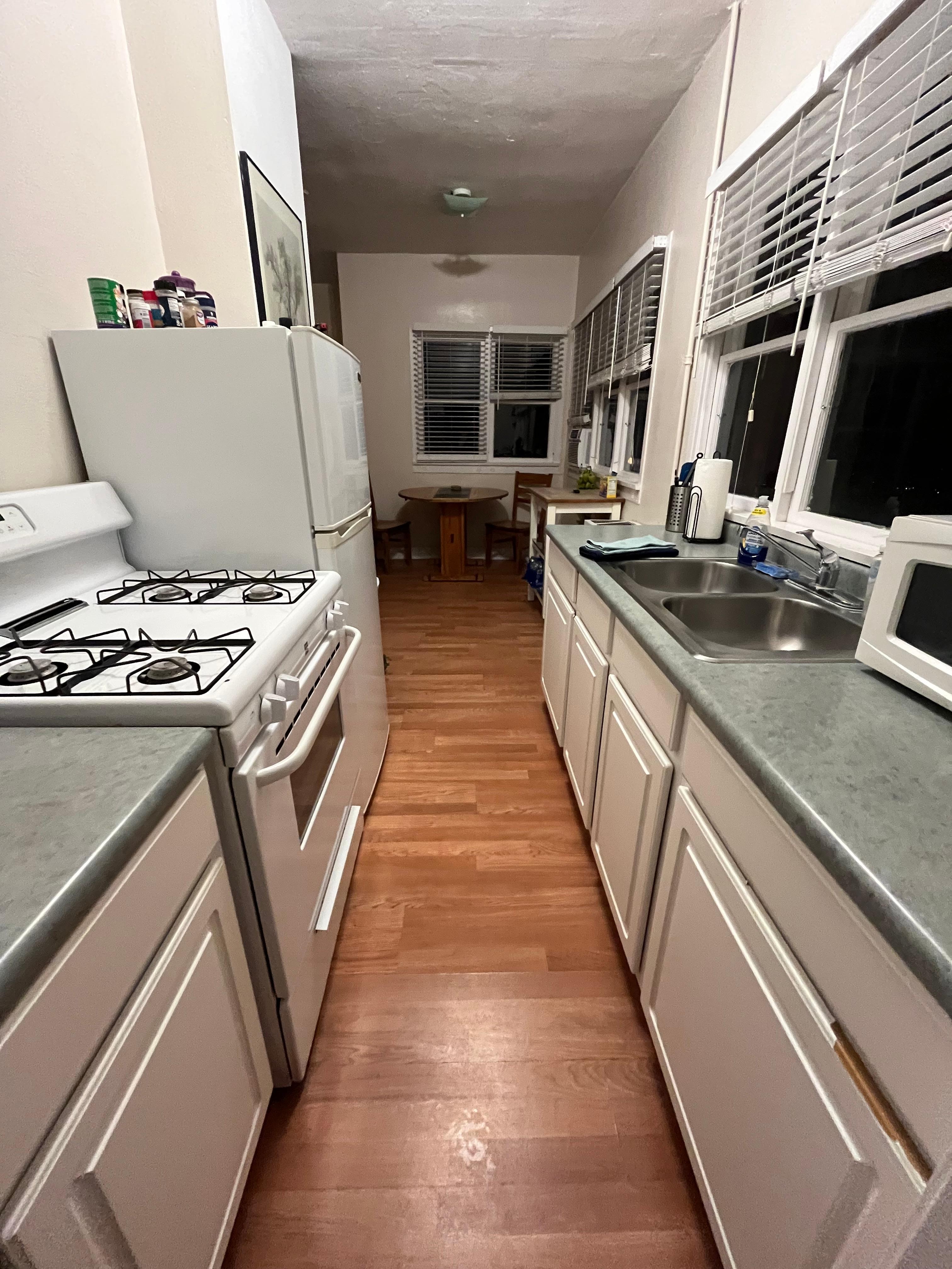 Galley kitchen is small but has everything you need.