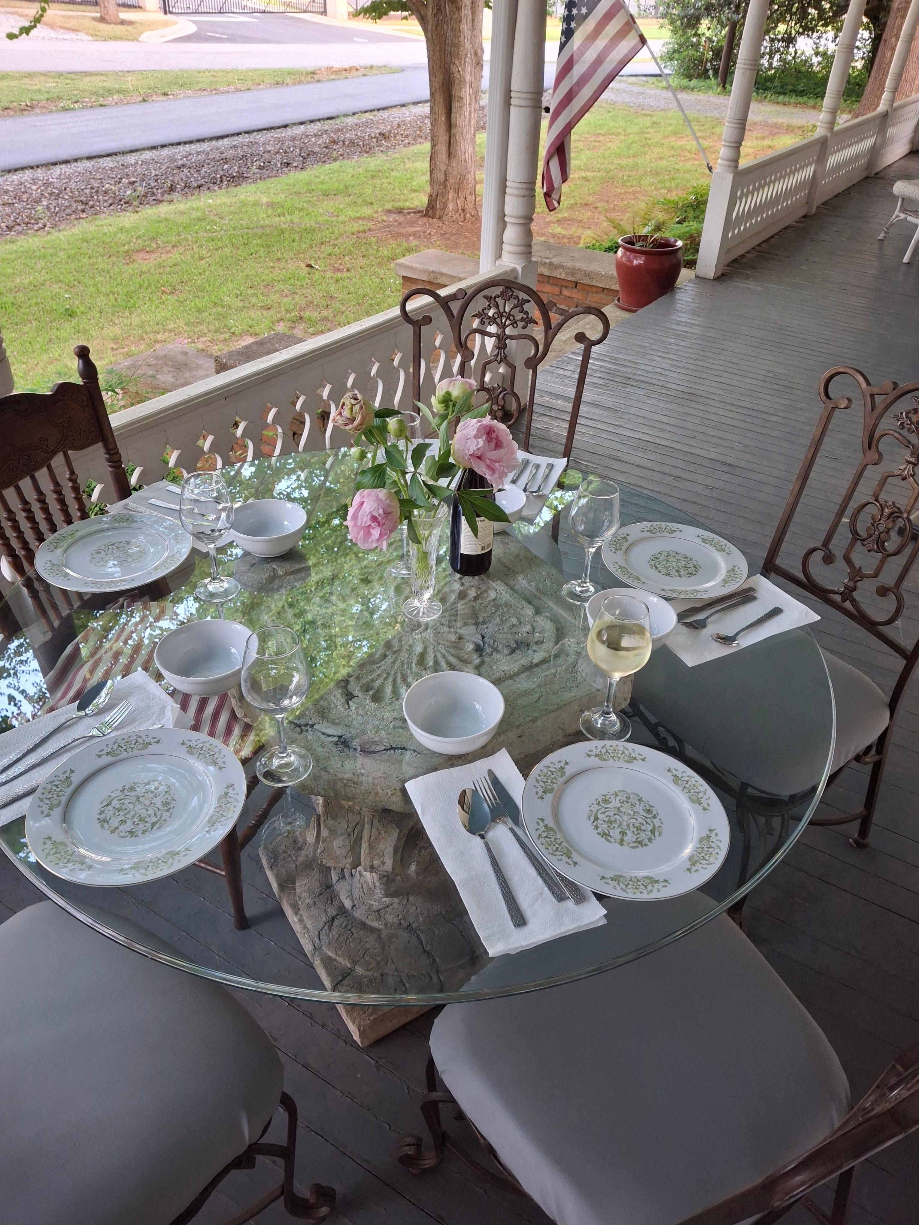 The beautiful china on the front porch for our dinner.