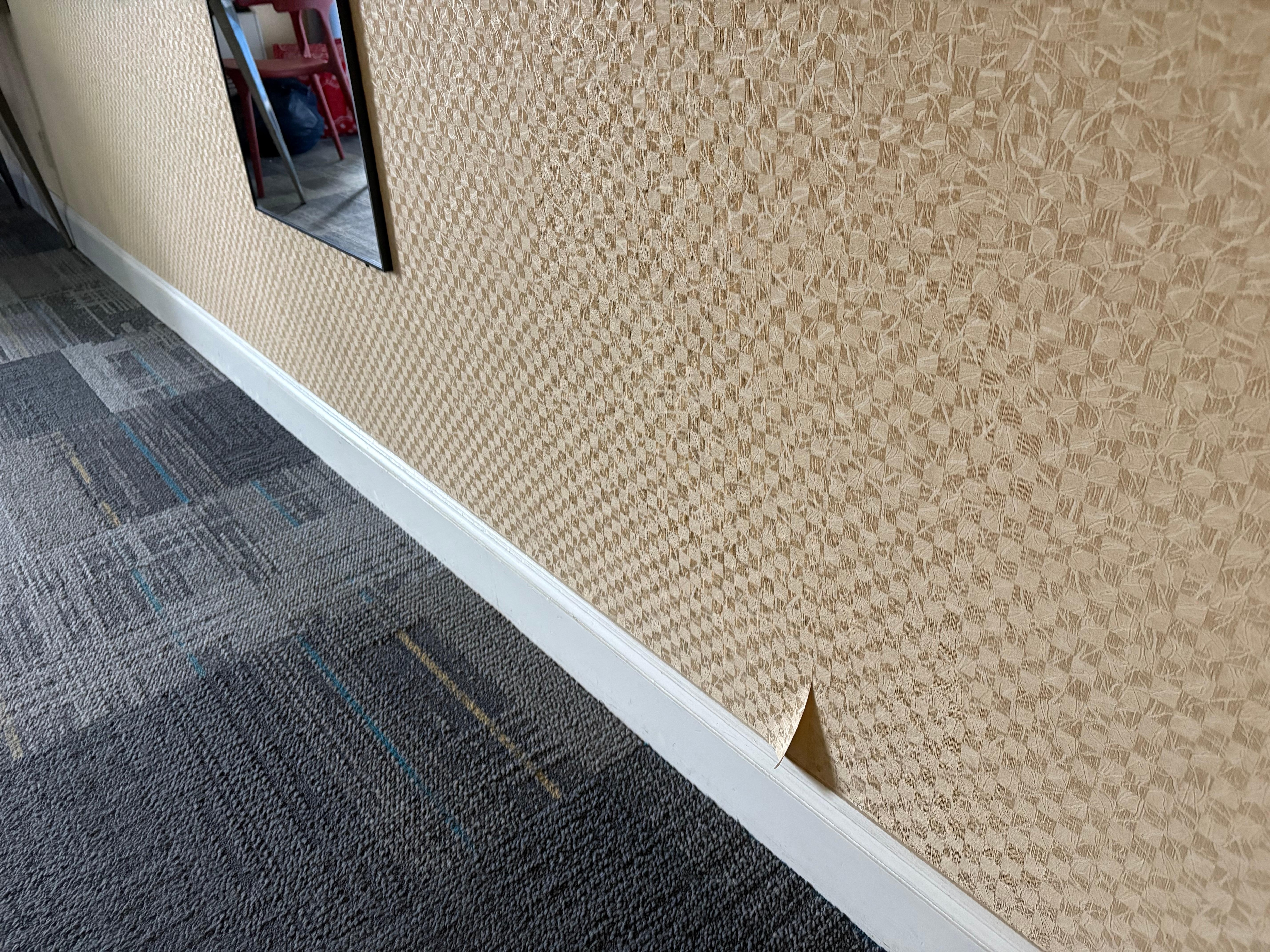 wall paper a tear we informed front desk