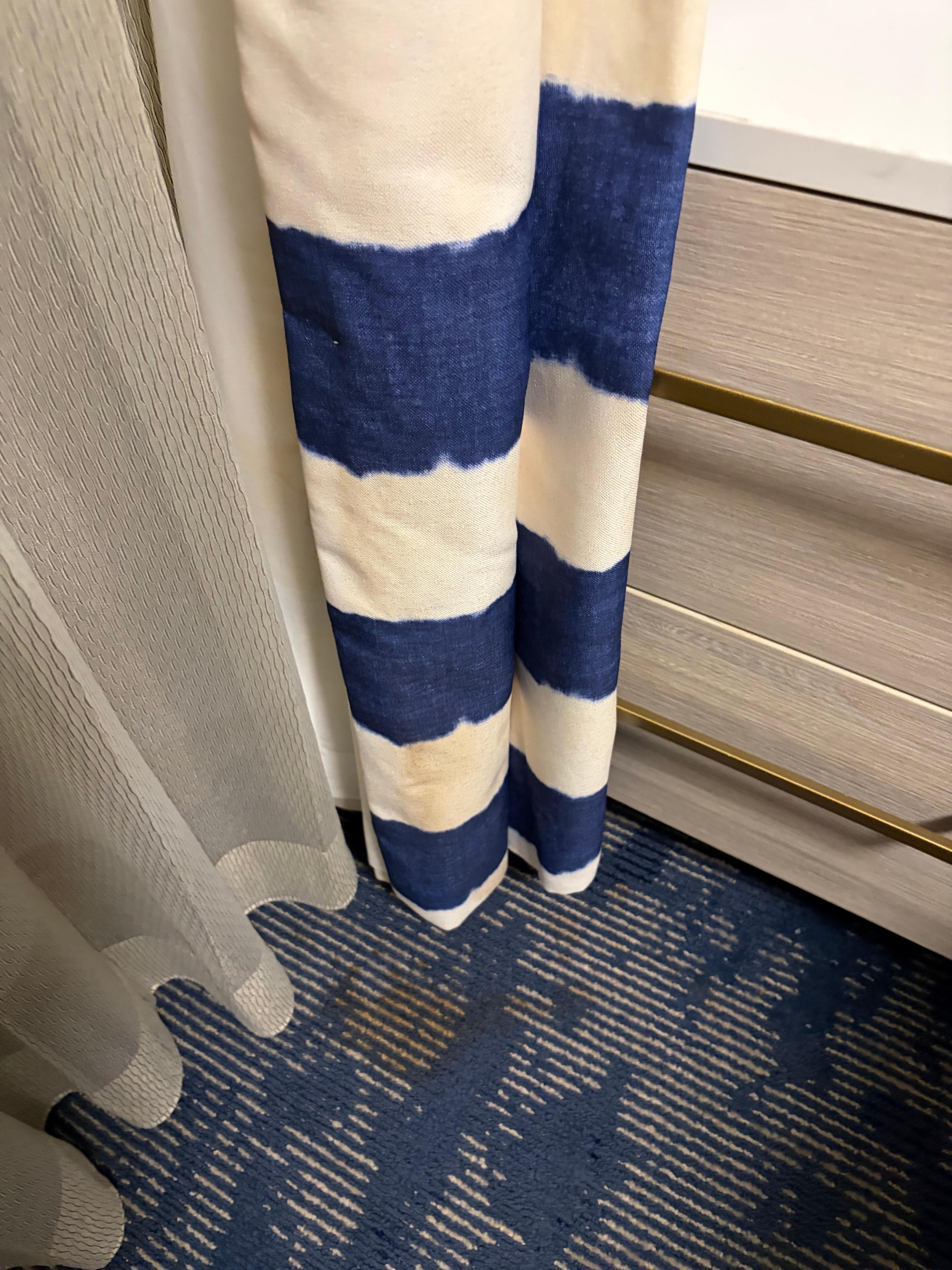 Stains on curtains and rug.