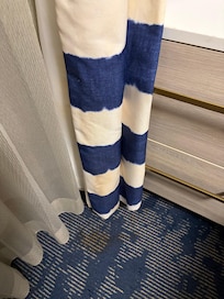 Stains on curtains and rug.