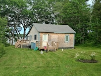 Walking up to the cottage. The deck and living room are to the back - overlooking the water.
