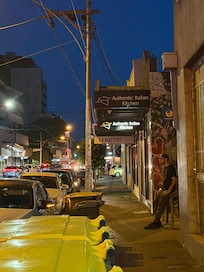 Lygon street at night near unit with great Italian restaurant