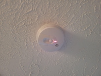 One close up flashing green and red light.