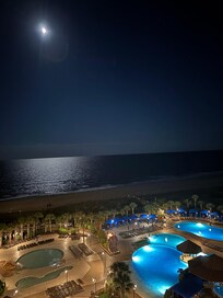 Moonlight ocean view and the pools.