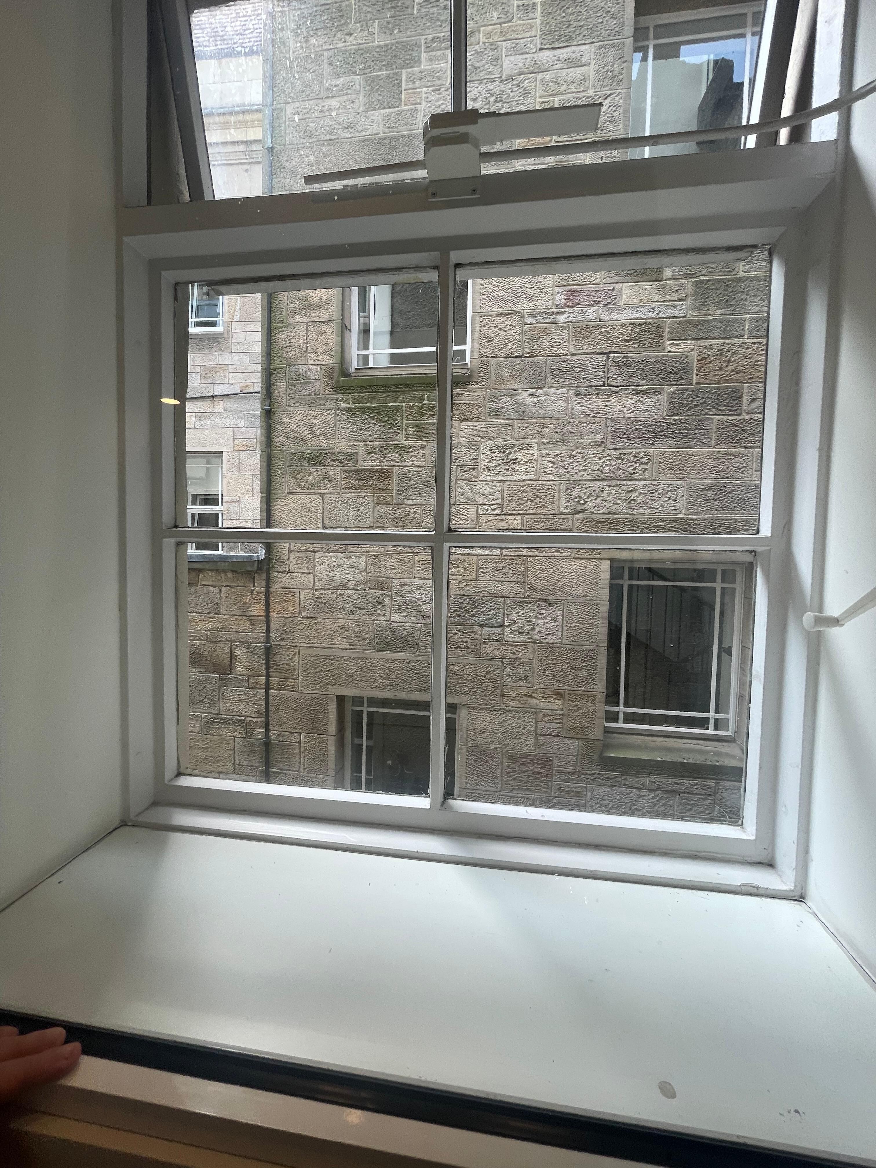 Standard room with view of a wall...there is a walkway down below with lots of late night foot traffic and happy bar patrons. We didn't mind that.  Windows open. Blackout Curtain help with Late Sunsets and early sunrises in June/summer months. 