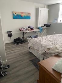 Spacious comfortable bed room. There is a closet to hang some clothes.