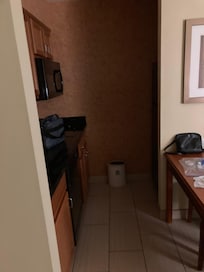 Kitchen: full refrigerator, stove top, coffee maker, microwave, dishwasher, garbage disposal and kitchen table.