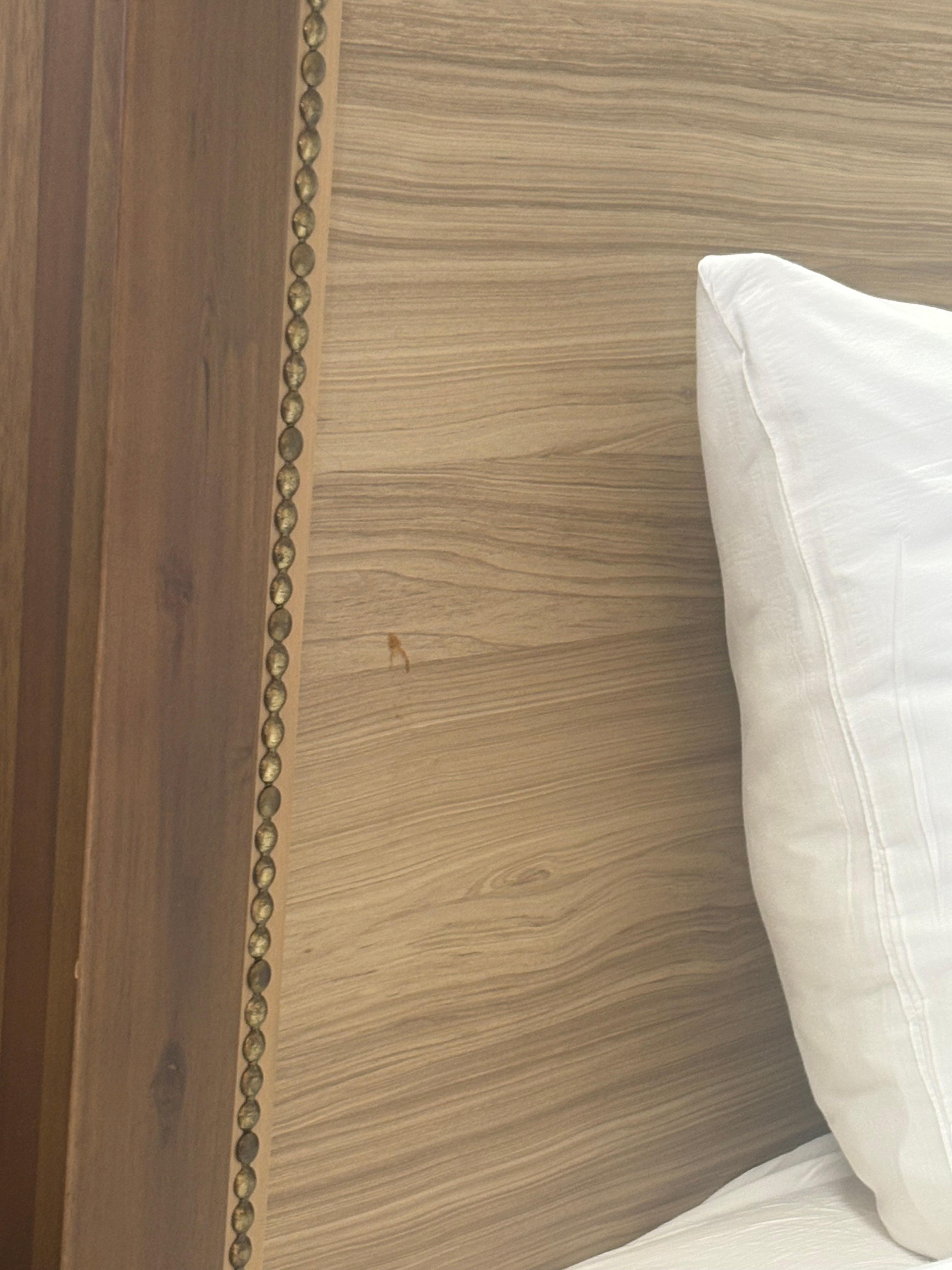 Dirty stuff on the bed frame, and they have cigarettes around the bed so somebody was smoking