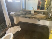 Formerly a double sink countertop, but the left-hand sink was covered over and the drain pipe capped below the counter.