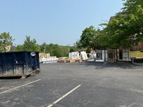 The parking lot in front of the hotel