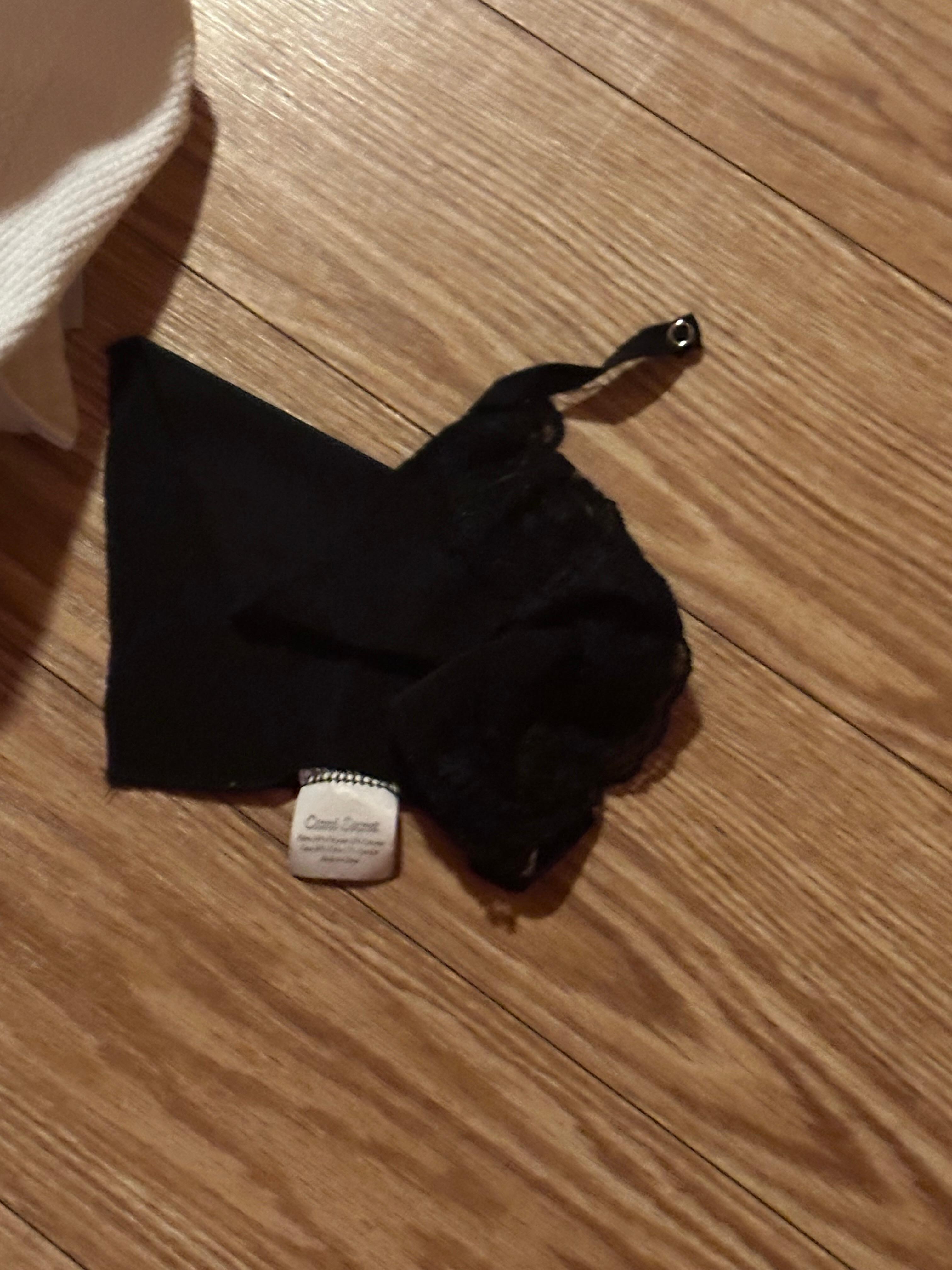 Lingerie that was on the floor next to washer and dryer.