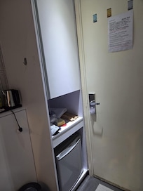 Enough space for hanging cloths and mini fridge.