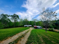 The driveway entering the property.