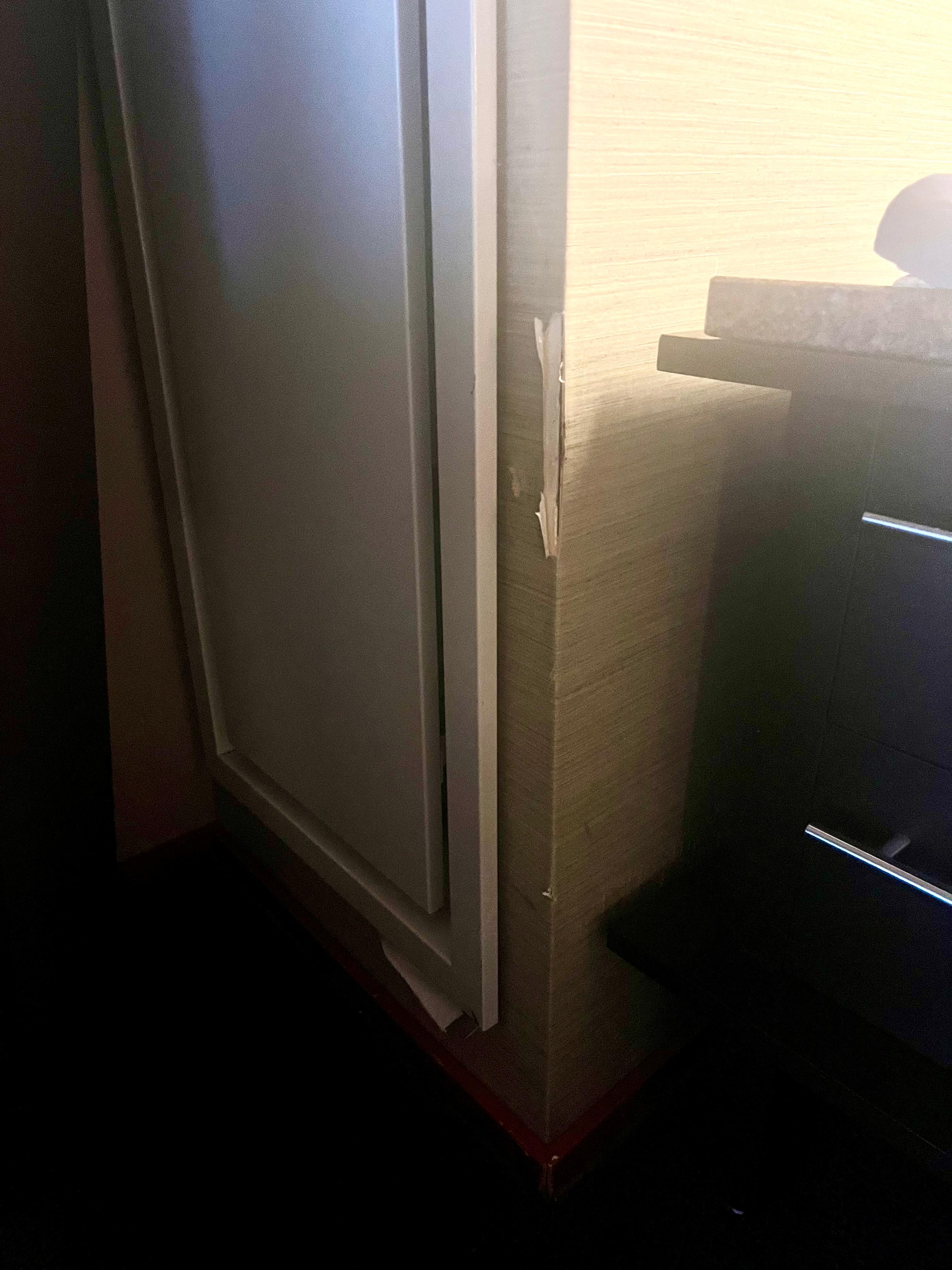 This was a constant issue on all the corners of walls; either the wall paper was door and drywall chucks missing.