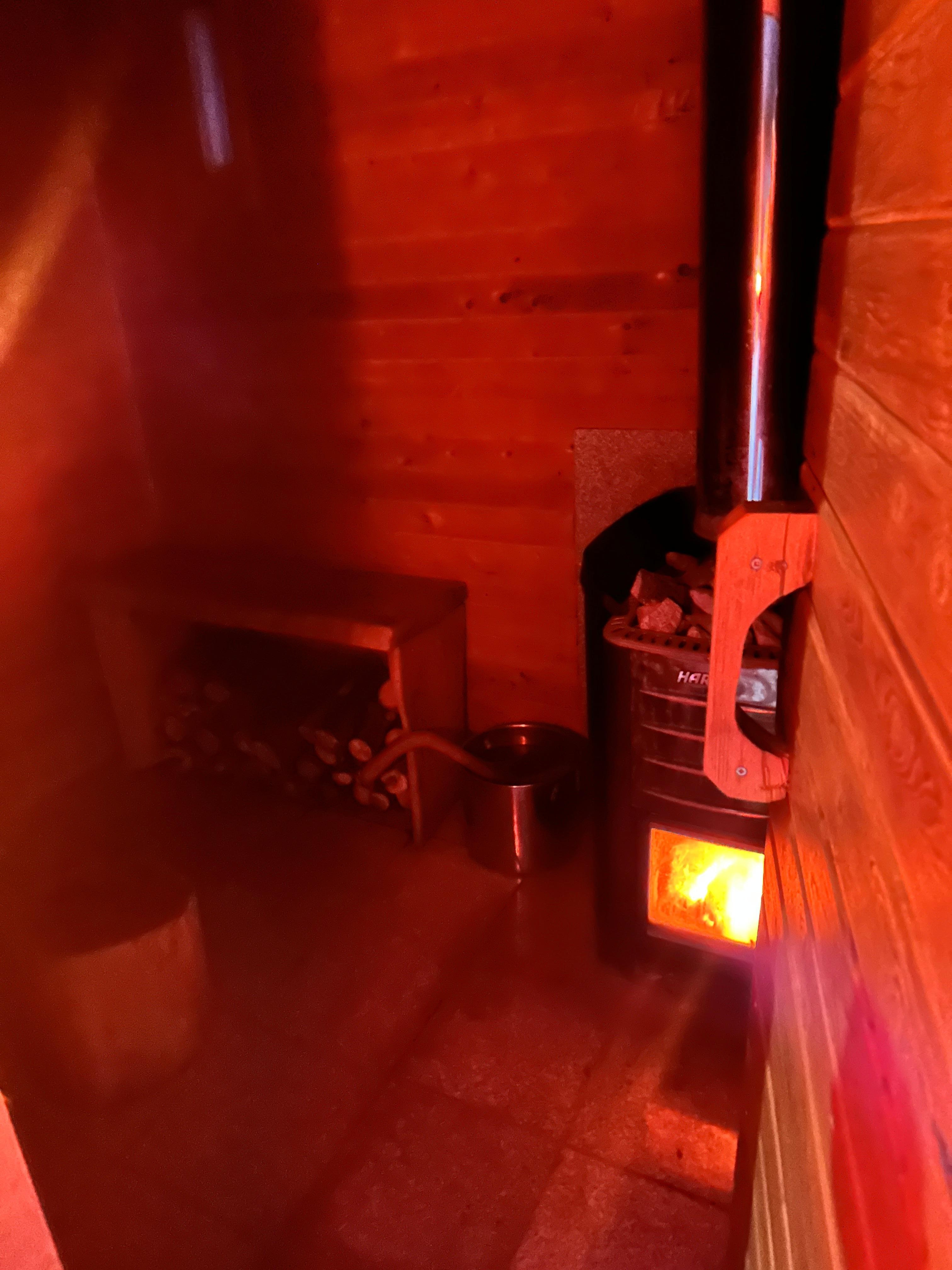 Outdoor wood burning sauna. Bring a folding chair for more comfortable seating for 2 people. Also a candle is helpful for night sauna sweats.