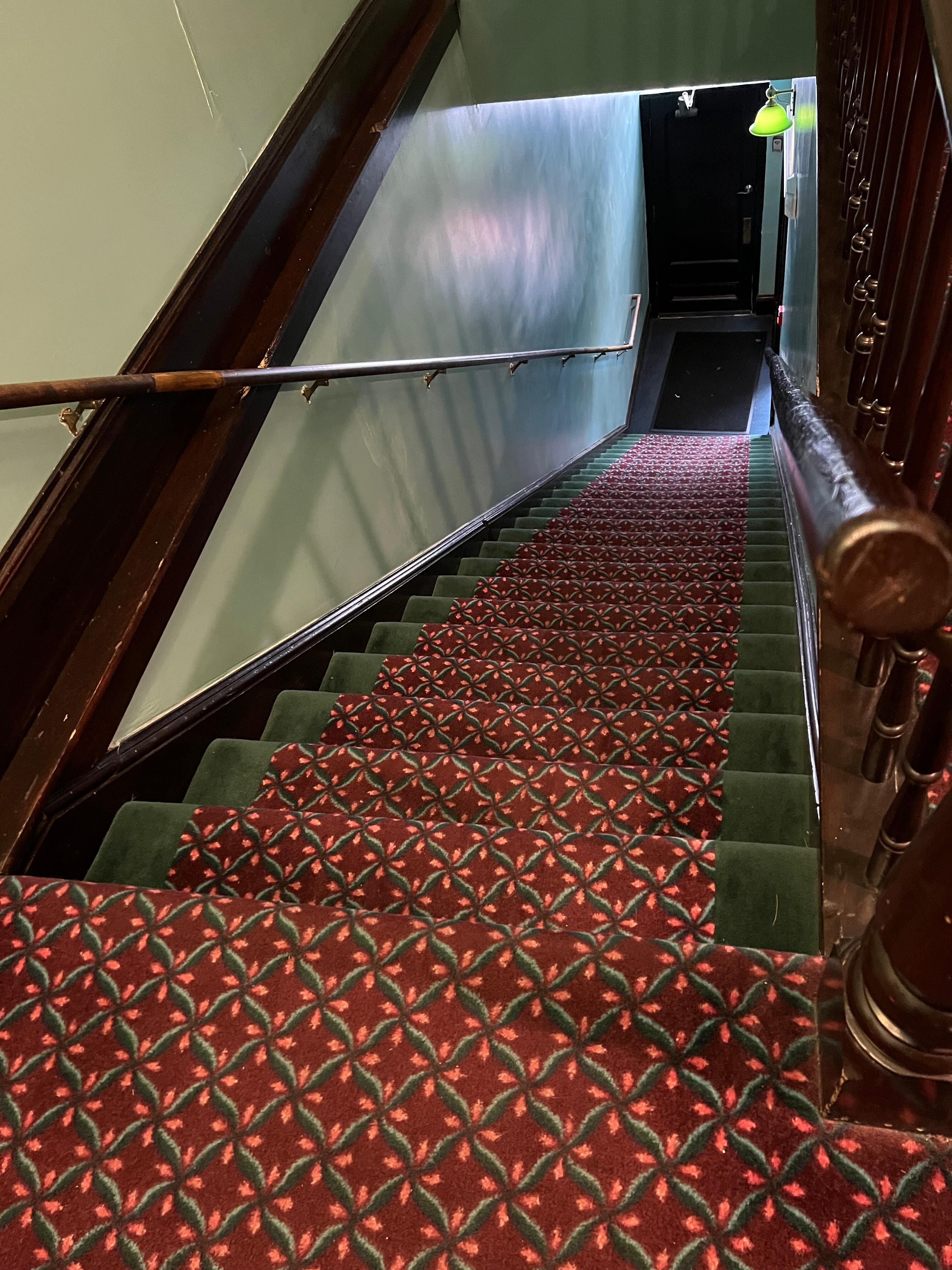 Looking down the stairs from second floor
