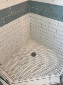 shower stall full of sand