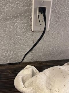 pouring out of the outlet down the wall and on the table