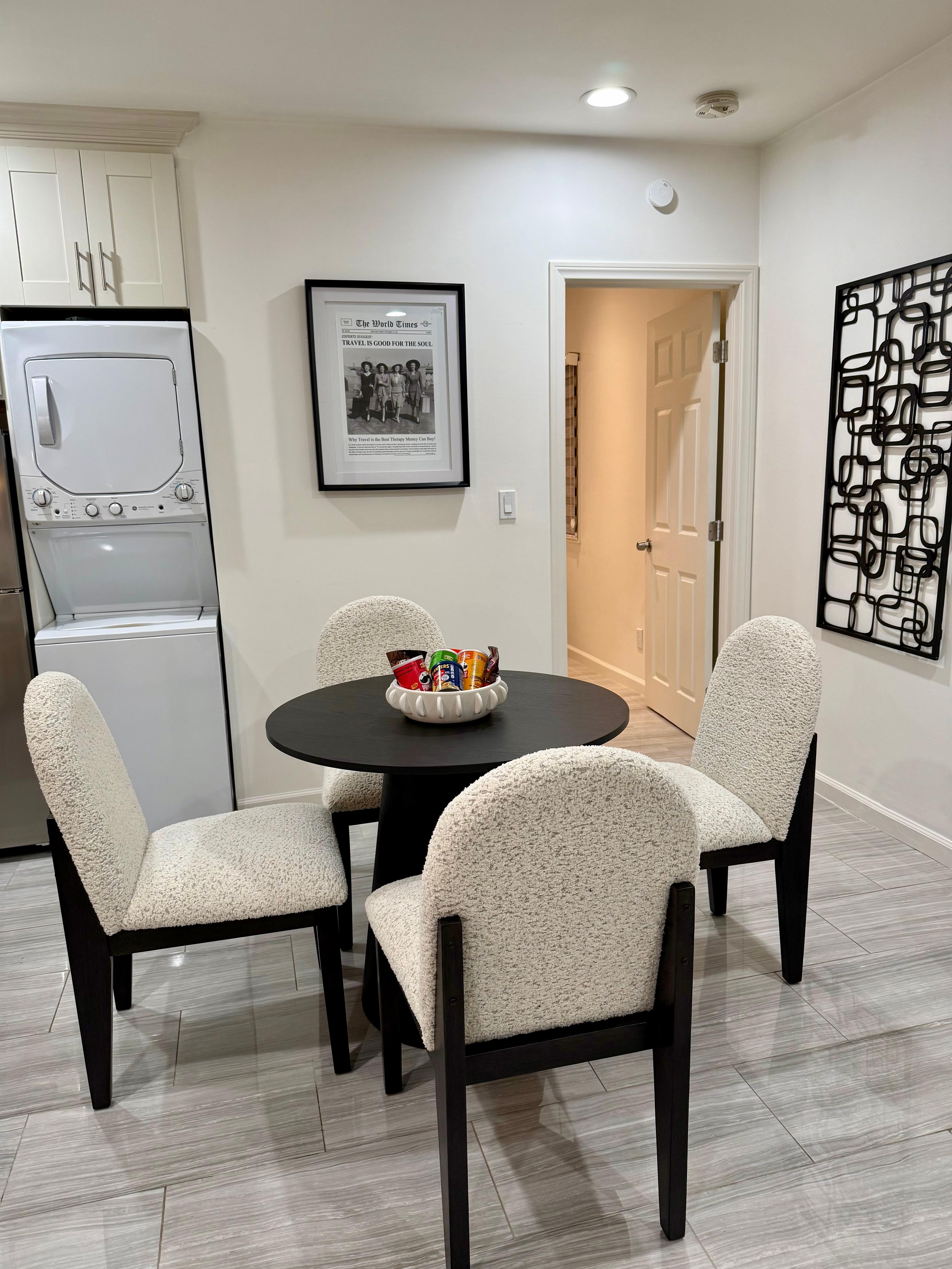 Dinette with comfortable chairs and some treats on the table