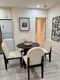 Dinette with comfortable chairs and some treats on the table